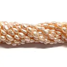 Fersken farvede ferskvandsperler, 6-7mm aflang nugget, hel streng - 